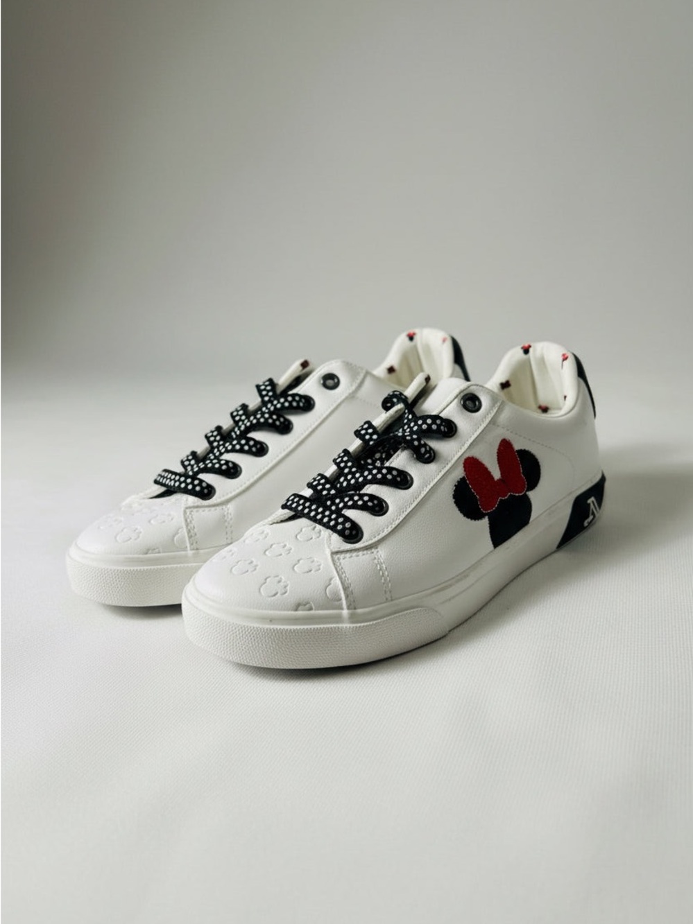 Disney White Sneakers with Black Accents and Red Bow